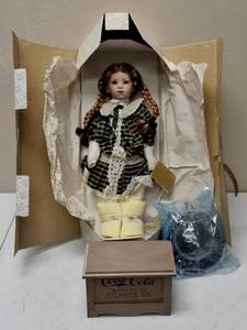 lot 74 image: Franklin Heirloom  Elise Porcelain Doll Comes with Coca Cola Toy Box, Accessories & Hat - Coca Cola Series