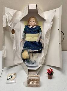 lot 77 image: Franklin Heirloom - Camilla Porcelain Doll with Coca-Cola Crate, Flowerpot, Gloves & Shovel - Coca-Cola Series