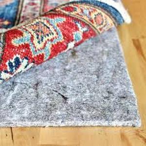 lot 39 image: RUGPADUSA Natural Comfort 7 ft. x 9 ft. Rectangle Felt Cushioned 14 in. Thickness Dual Surface Non-Slip Rug Pad  Customer Returns See Pictures