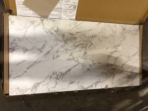 lot 49 image: Hampton Bay 4 ft. L x 1-12 in . T Configurable Laminate Countertop in Matte Marmo Eracle with Square Edge Damaged   Customer Returns See Pictures