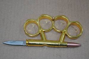 lot 31 image: Bullet Folding Knife Paper Weight