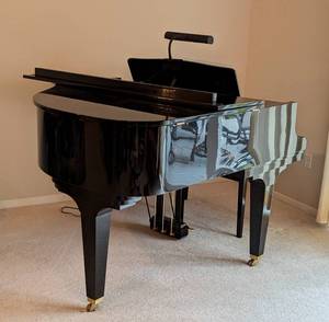 lot 2 image: Kawai Ebony Baby Grand Piano