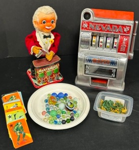 lot 113 image: Vintage TOYS From the Past Slot Machine Coin Bank, Mechanical Bartender, GI Joe Cards, Mini Army Men & Marbles