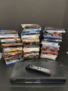 lot 124 image: Huge Lot of DVD Movie Disks & SAMSUNG dvd Player