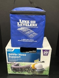 lot 241 image: CAMPER ACCESSORIES Including Lynx Levelers & Camco 20 Sewer Hose Support New in Boxes