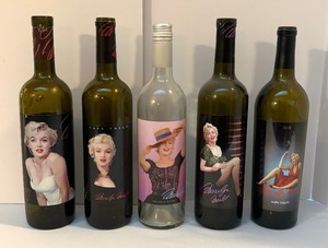 lot 47 image: Five Marilyn Monroe Motif Glass Bottles