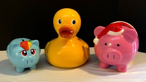 lot 108 image: Three Adorable Piggy Banks and Planter