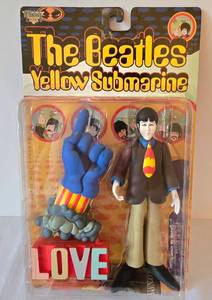 lot 55 image: The Beatles Yellow Submarine Paul and Glove with Love Base Figures