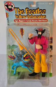 lot 37 image: The Beatles Yellow Submarine Sgt. Peppers Lonely Hearts Club Band John with The Bulldog Figures