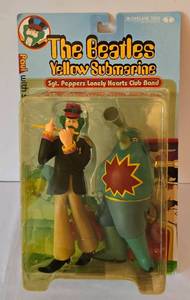 lot 38 image: The Beatles Yellow Submarine Sgt. Peppers Lonely Hearts Club Band Paul and Sucking Monster Figures