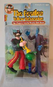 lot 39 image: The Beatles Yellow Submarine Sgt. Peppers Lonely Hearts Club Band Ringo and Apple Bonker Figures