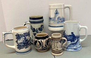 lot 191 image: Six Collectible Mugs including a Delft Mug