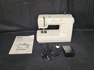 lot 25A image: Kenmore Sewing Machine Model 385.15510200 with Owners Manual