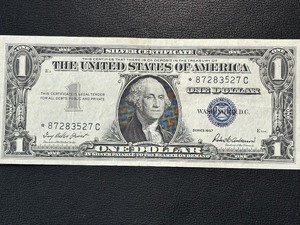 lot 21 image: 1957 Blue Seal $1 Dollar Silver Certificate