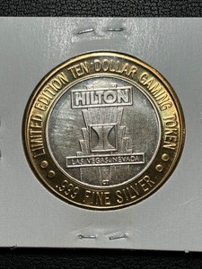 lot 72 image: .999 Fine Silver $10 Dollar Gaming Token Hilton Starlight Express