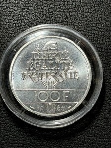 lot 101 image: 1986 100 Franc Coin