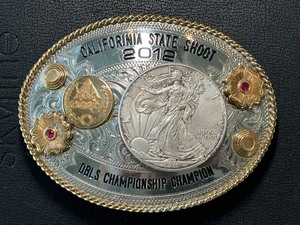 lot 178 image: 2012 California State Shoot Buckle with 2012 Silver Eagle