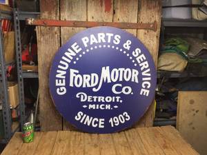 lot 103 image: Ford Motor Co. 31 Round Acrylic Old-Look Sign
