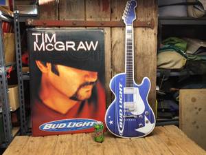 lot 153 image: Bud Light Guitar & Tim McGraw Embossed Metal Signs