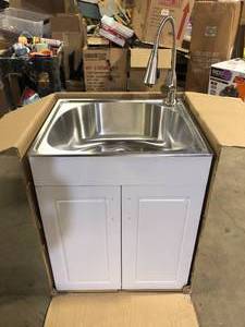 lot 6 image: Glacier Bay 24 in. W x 21 in. D x 34 in. L Stainless Steel LaundryUtility Sink with Faucet and Cabinet in White Slight Damage   Customer Returns See Pictures