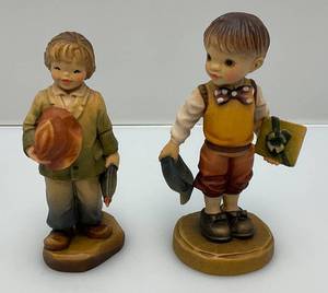 lot 64 image: 1990s ANRI Fernandiz  Exclusive Club Pieces Wood Figurines Boy With Present 4 12 & Boy With Umbrella 4 14
