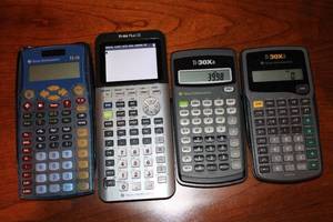 lot 32 image: Lot of 4 Used Texas Instruments Calculators - TI-15, TI-84 Plus CE, TI-30Xa