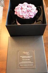 lot 44 image: Box of 12 Lavender Magnificent Roses - Elegant Gift Arrangement
