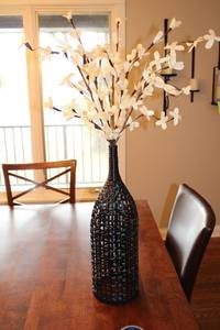 lot 106 image: Elegant Decorative Woven Basket with Faux Floral Arrangement