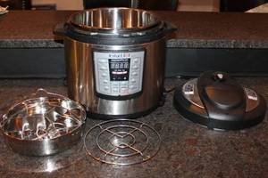 lot 200 image: Instant Pot Duo 6 Qt Electric Pressure Cooker with Accessories