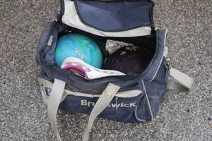 lot 309 image: Brunswick Bowling Bag with 2 Bowling Balls and Bowling Shoes
