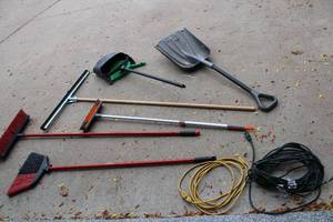 lot 316 image: Mixed Lot of Gardening and Cleaning Tools Including Brooms, Rakes, and Extension Cords