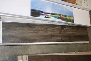 lot 10 image: (4) Black Hills Voyageur Collection Timeless Gravity Plank Flooring By Cheney Carpet Inc..