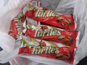 lot 215 image: 12- 1.76 oz Turtles Bars...