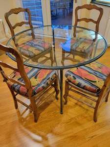 lot 38 image: Glass Top Dining Table with 4 Chairs and Seat Cushions.
