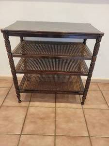 lot 141 image: A Vintage Four Tiered Side Table with Cane Webbing Shelves and Turned Legs.