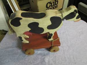 Wooden Cow pull-a-long toy...