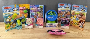lot 126 image: Brand New Collection of 10 Kids Toys Melissa & Doug Sticker Wow Books, Mini Backpack with Stationary, Fubbles Bubble Machine, Minnie Sungalsses and More W