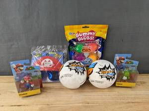 lot 98A image: Brand New 2 Super Mario Bros. Figurines, 1 Super Mario Headpiece,  2 Zuru Awesome Pop, and a Bag of Gummy Globs W