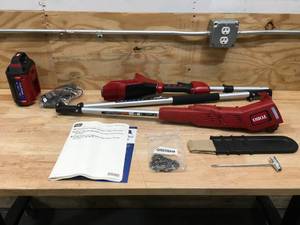 lot 29 image: Toro 60V Cordless Pole Saw With 2 Ah Battery and Charger Model # 51870