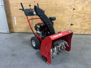 lot 3 image: TROY-BILT Storm 24 in. 208 cc Two- Stage Gas Snow Blower with Electric Start Self Propelled