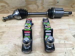 lot 143 image: Lot of 2 Ball Hitches and 1 CV Drive Axle