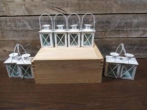 lot 86 image: Neat Wooden Crate with 8 White Candle Lanterns