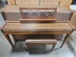 lot 7 image: Used Wurlitzer Console Piano with Matching Bench and Piano Instruction Book