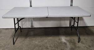 lot 38 image: Used Folding Table with Gray Surface