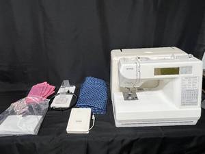 lot 92 image: Kenmore Model 385 Sewing Machine with Accessories and Embroidery Hoops - untested