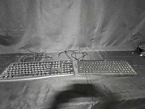 lot 157 image: Lot of 2 Used Keyboards Logitech K120 and HP Wired Keyboard