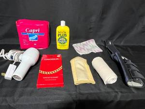 lot 180 image: Mixed Lot of Health and Personal Care Items including Bladder Pads, Wrist Supports, Jewelry Cloth, and More