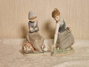 lot 52 image: Flawless Lladro Porcelain Figurines  Girl with Duck & Girl Picking Flowers