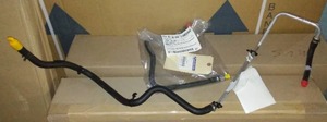 lot 588 image: Power Steering Return Hose - Mopar (5154406AE). Power Steering Return Hose - Mopar (52124650AH)