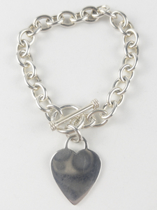 lot 29 image: Heart Sterling Silver Charm Bracelet.